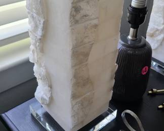 Lots of other lamps including this white stone lamp, along with other table and floor lamps. One floor reading lamp lights up on top really cool and another looks like a tree and lights up.