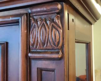 Close up detail of the sliding door on the curio cabinet.