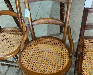 Many vintage caned chairs
