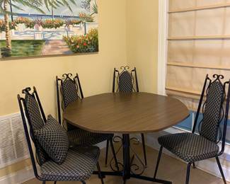 1950’s? Dining set in VERY good condition. Black metal frames. Upholstery could use a little wipe off but otherwise it is ready to use!