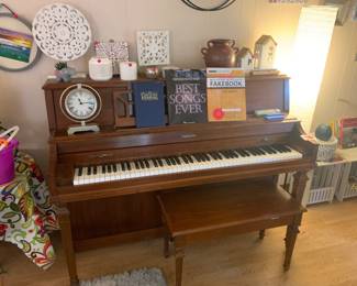 Baldwin upright piano and piano bench