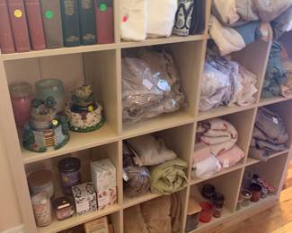 Candles, books, linens, and bedding