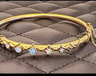 Gold and opal bracelet . Please read the directions carefully as this is a gated community. We must follow the HOA guidelines on order to bring you this special estate sale 