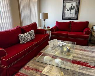 You can buy this sofa set NOW. Look under the sales description for contact information.
Red sofa and love seat, Erte print, coffee table, and many decorative items