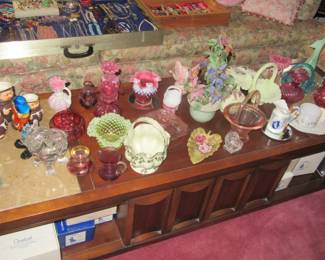 Steffans table full of fenton and glass