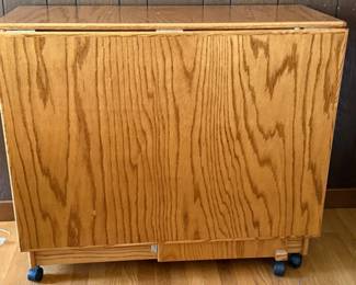 126 OakFoldingTableonCasters