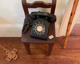 Early child’s chair and rotary phone.