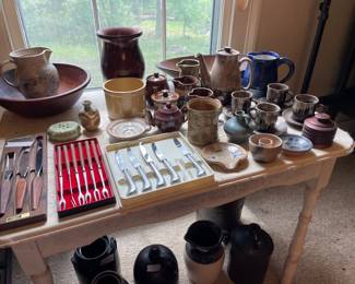 A table full of pottery.