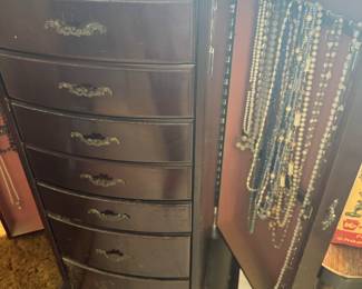 Jewelry armoire with necklaces
