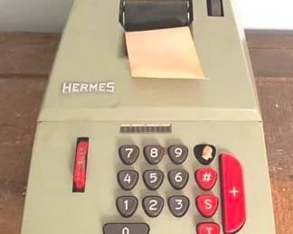 46 - Hermes Electric Adding Machine - 7" x 6" x 14" You are buying a used as-is electric/electronic item. We do not guarantee all components are present, and if it is not expressly stated, it is untested.