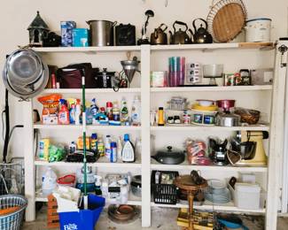 Garage storage: Copper kettles, stock pot, serving trays, stand mixer, white dishes, food storage, crock pot and kitchen items. Household care products