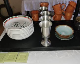 Pasta plates, pewter goblets and pottery mugs