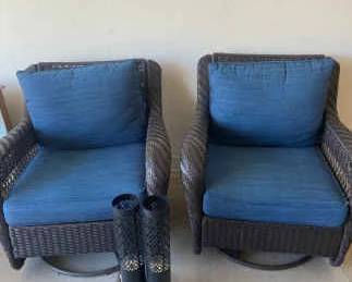 Two Rattan Swivel Chairs And Lanterns.