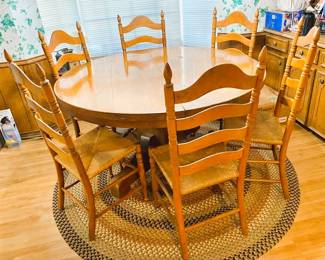 Round Farm Table with 6 chairs. Rag-style rug