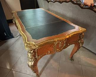 Writing Desk
Item: Vintage French Louis XV Style Figural Bronze Ormolu Leather Top Bureau Plat Writing Desk
Details: Large, impressive size, stunning bronze figural female bust mounts on all legs, faux drawers to rear, 3 functioning drawers to front, black 3-part tooled leather top with gold gilt details, beautiful kingwood inlay, very nice French style desk.
Dimensions: 67” long, 37” wide, 30.75 Height
Condition: Good $1900