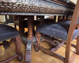 Dining Room Table
A Louis XVI style of scalloped and beveled green multi-colored marble top dining table with an elaborately carved wooden base having a swag, pierced shell and waterleaf motif resting on curved scroll legs. Dimensions: 63" L x 37" W x 30 1/2" H There are a few age-related dull spots to the polished marble, overall good condition and presents well.
Dimensions: Width 47”, 94.5 Length (one solid piece) Height 30.5”
Chairs: Includes 2 Captain Chairs (Arms) and 6 Armless Chairs (8 Total)
Features an exposed wood frame with finely carved details. Shapely carved legs are joined by a carved stretcher. Frames are finished in a walnut finish with distressing. Upholstered in a soft distressed dark brown leather with burnished nail heads.
Dimensions: 46” Height, Seat 20”x 21” Seat Height 19”
Condition: Good $2500