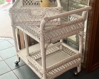 Wicker bar cart. On rollers, removable serving tray.