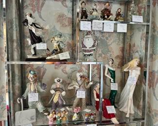 Figurines on the chrome shelf include Romani and Goebel.