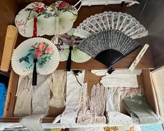 Vintage hand fans, ladies' gloves, socks, collar yokes, and scarves.