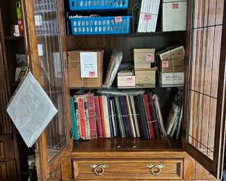 A stamp collection dating to 1800. Binders and file boxes are filled using the Scott numbering system. Includes circulated and uncirculated stamps, postcards, stamped envelopes, and mint sheets.