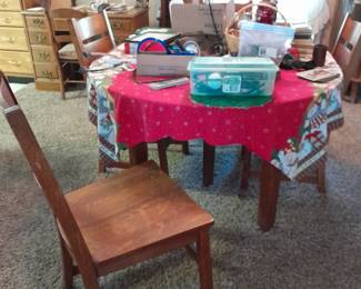 Table with several leaves and chairs