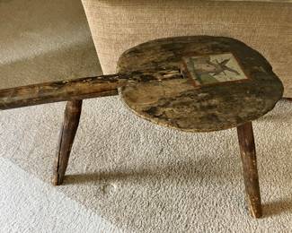 Primitive three legged milking stool
