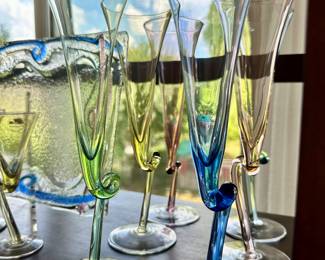 Detailed View of Stunning Multi Colored Formal Glassware Available Including Italian Ivat Glassware "Dancing" Champagne Flutes & Cordials.