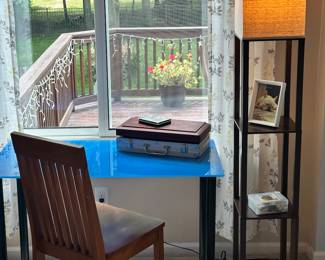We Love Gaming and this Stunning Blue Tempered Glass Top Desk Table Fits the Bill and is Shown with a Walnut Floor Lamp with 2 Shelves and Ivory Shade, 62.5"H.