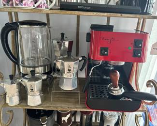 Starbucks Barista Saeco Italy Espresso Machine in Red, Shown with Bialetti Moka Express Espresso Maker Collection and a Cosori Electric Coffee Carafe.