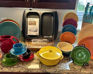 FiestaWare Turns Every Table into a Happy Gathering and is Shown with an Aroma Warming Buffet Server and Fun Blue Handled Knife Set.  FiestaWare is a Service for 4 with Serving Pieces and Extras.