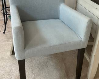 West Elm Arm Chair Upholstered in Light Blue with Wooden Legs, 22.5"W x 23"D x 34.5"H.