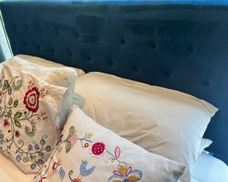Detailed View of the Stunning King Size Velvet Blue Tufted Headboard by Emerald Home and Vintage Alfhild Fagel Cushion Covers.