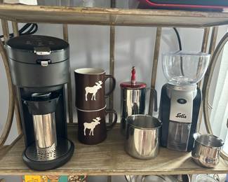 Great Solo Single Serve Coffee Maker Shown with A Pair of Starbucks Moose Coffee Mugs, a Solis Scala Plus Coffee Grinder and Lavazza Stovetop Moka Pot.