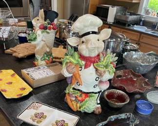 Assortment of wood chopping boards, pottery, ceramic platters, large pewter bowl