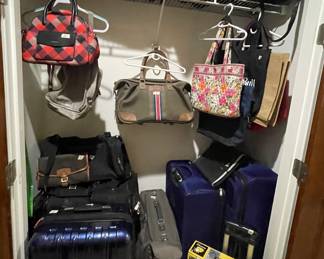 Assortment of luggage and carry on bags