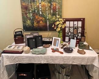 Assortment of pottery and picture frames and baskets