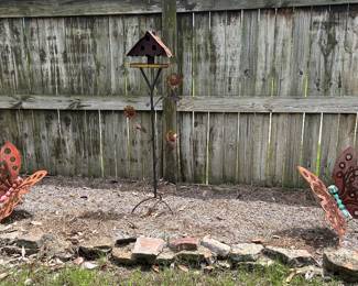 bird feeder and large metal butterflies