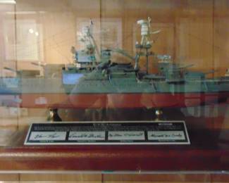 Lot 060 model of USS Battleship Arizona, with signatures in case.
