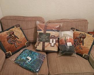 Kokopelli pillows, couch and southwestern theme blankets