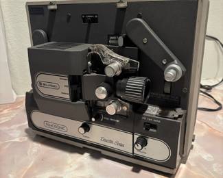 Vintage Bell & Howell Film Projector and Screen
