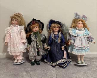 Lot of Four Collectible Porcelain Dolls