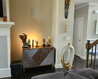 *2 Accent cabinets 
 Finish Brown
 Width 46″ wide
 Height 32″ high
*Gold decorative vase
*Decorative African art
*Decorative accessories 