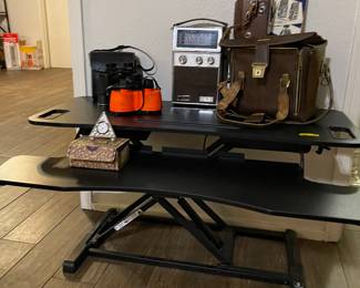 This table sets on top of your current desk to enable you to stand or create more space. Whatever you need.