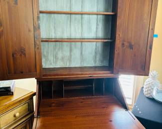 Mild mannered furniture turns into super desk.