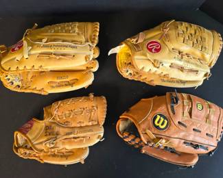 Assortment of Rawlings and Wilson Baseball Gloves