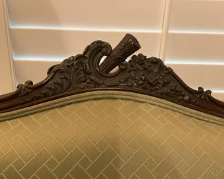 Antique carved chair with brass casters