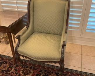 Antique carved chair with brass casters