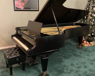 Mason & Hamlin 9 foot concert grand piano. Hand rubbed black satin with an adjustable artist bench. All parts original. Good condition. Built in 1969.