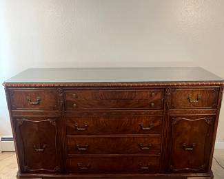 Gorgeous Antique Hard Carved Buffet. Gorgeous hand carved antique buffet. Piece is made of mahogany with burl veneer to accent drawer fronts and doors. Beautiful brass hardware adds a finishing touch. There is a glass top cut to fit to protect the top. See photos for condition.
35 1/2" Tall x 63 1/2" Long x 20" Deep
Note photos for details and condition. Measurements taken under field conditions are approximate within 1/2". Feel free to reach out with any questions.
Items are heavy and we do not assist with loading. Be sure to bring adequate help and a large enough vehicle for large items. If you need assistance, call Denny for an estimate for delivery. (720) 393-0204.