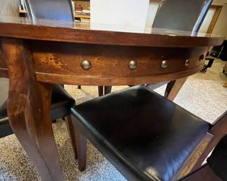 Round wooden dining table with a rich finish and four matching black vegan leather upholstered chairs. The set is perfect for cozy dining spaces. Estimated year: 2020. Table is 42” diameter x 30” tall.
Note photos for details and condition. Measurements taken under field conditions are approximate within 1/2". Feel free to reach out with any questions.
